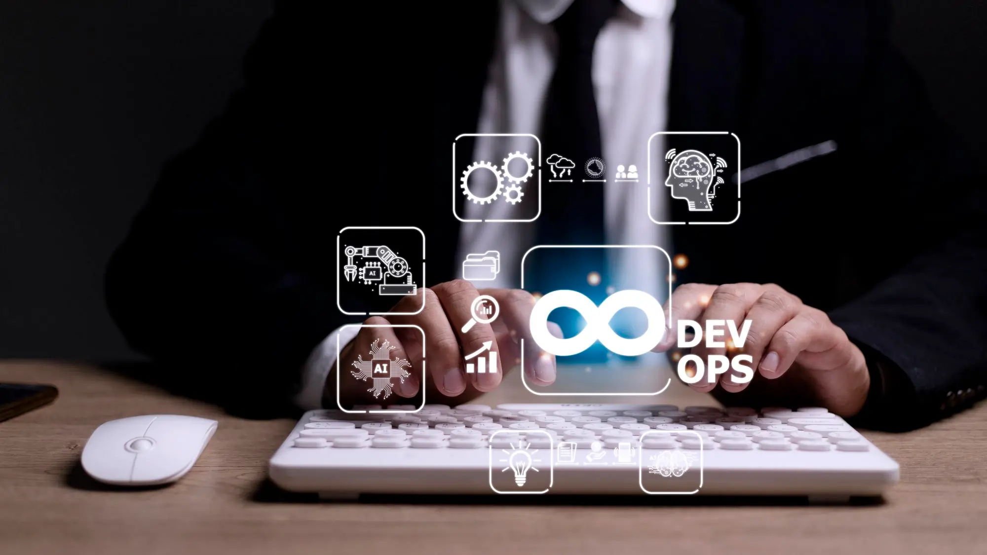 Hands typing with DevOps and automation icons