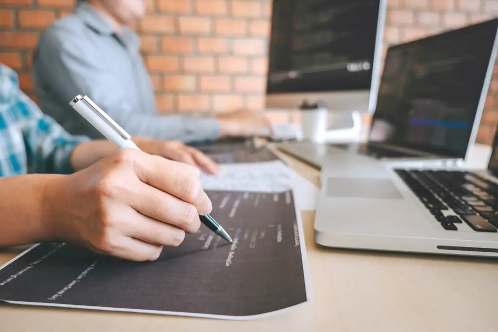 Software developers using a laptop