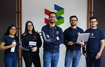 Ecuador Office employees looking at the camera smiling