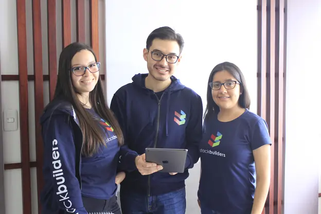 Ecuador Office developers smiling at the camera