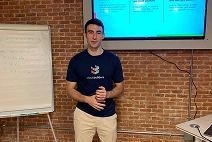 Spain Office employee explaining a slide to their colleagues