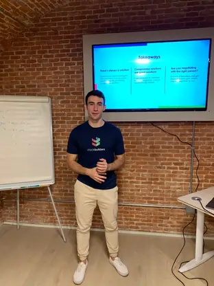 Spain Office employee explaining a slide to their colleagues