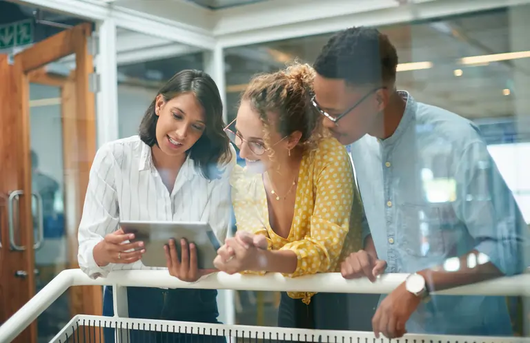 Business people discussion meeting with a tablet