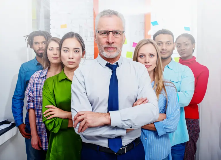 A business people team in front of a kanban board