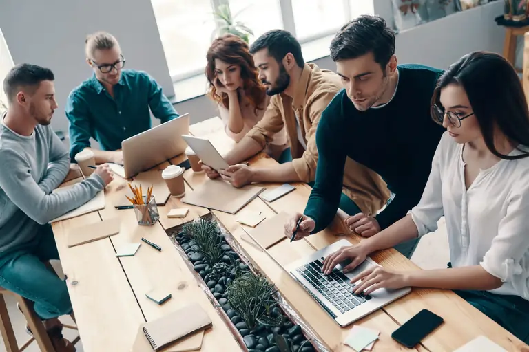 Group of people working together in an office